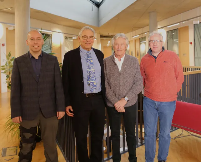 A group of people smiling at the camera