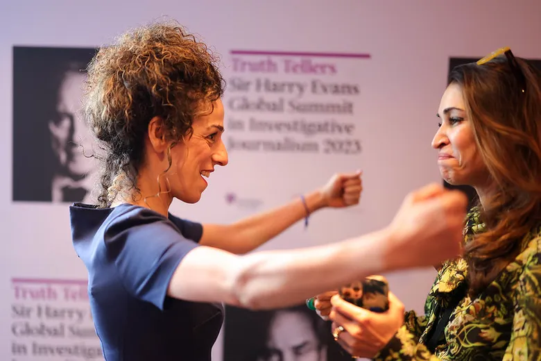 Two women greeting each other with happiness