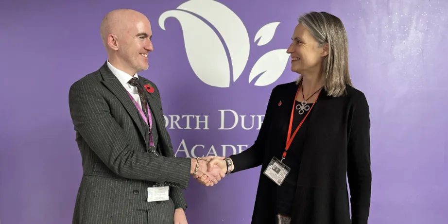 North Durham Academy Headteacher Mark Gray shaking hands with Chancellor Dr Fiona Hill