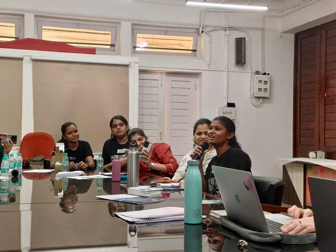People sitting around a table in discussion