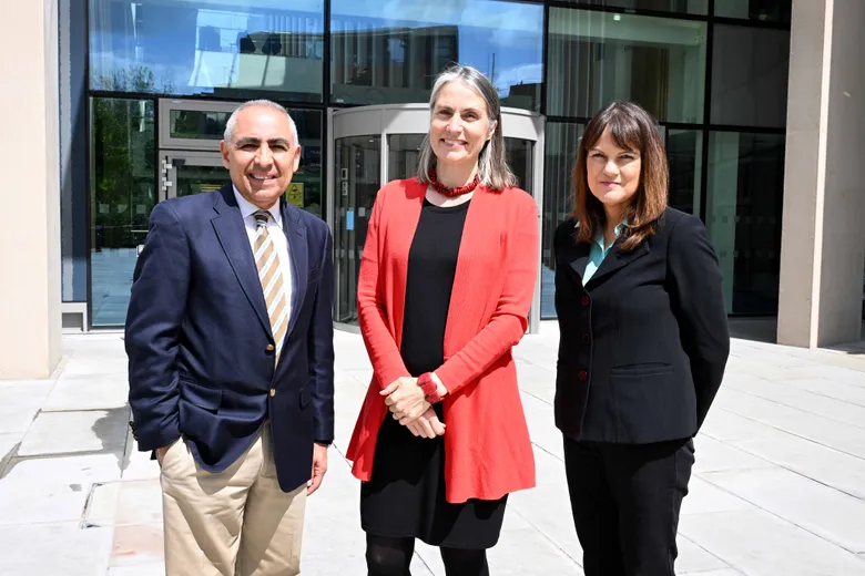 Dr Fiona Hill, Professor Barbara Keys and Professor Anoush Ehteshami stand side by side outside the Waterside building