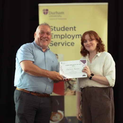 Charlotte pictured accepting her award certificate