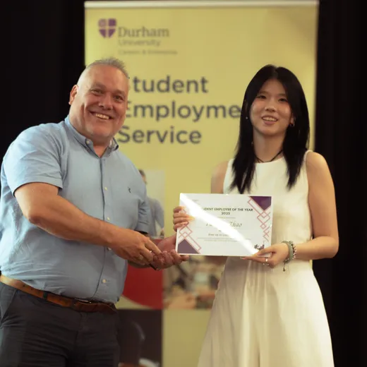 Yuetong accepting her award certificate