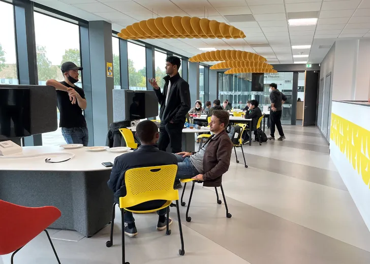 Hazan Venture Lab - purpose-built space for entrepreneurship with many people in attendance networking